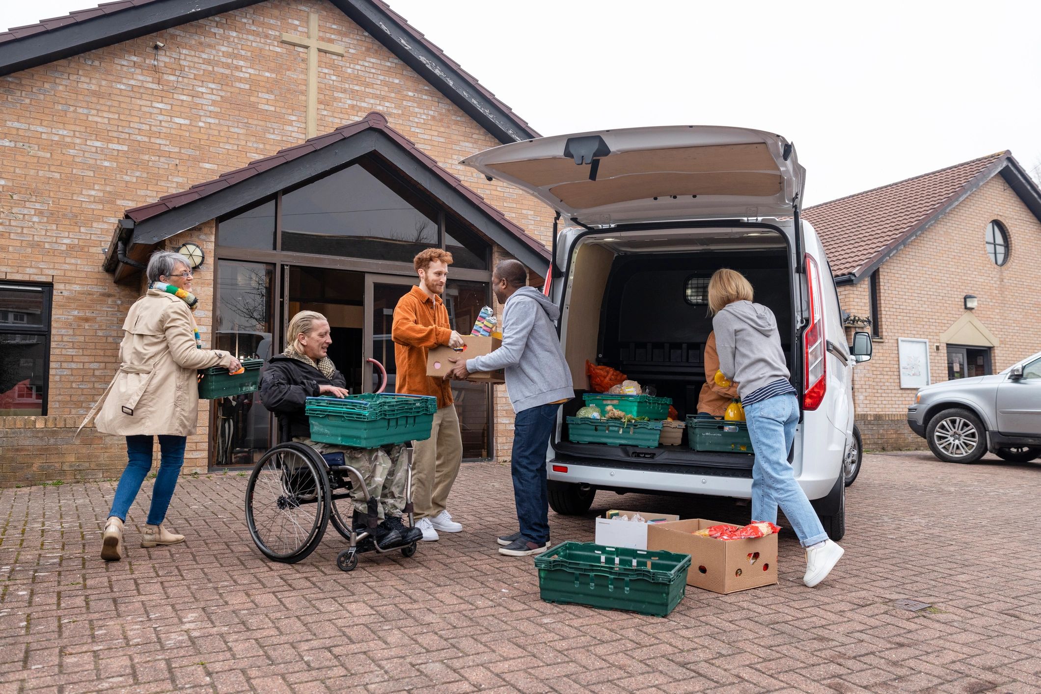 Volunteers unloading food donations during community outreach