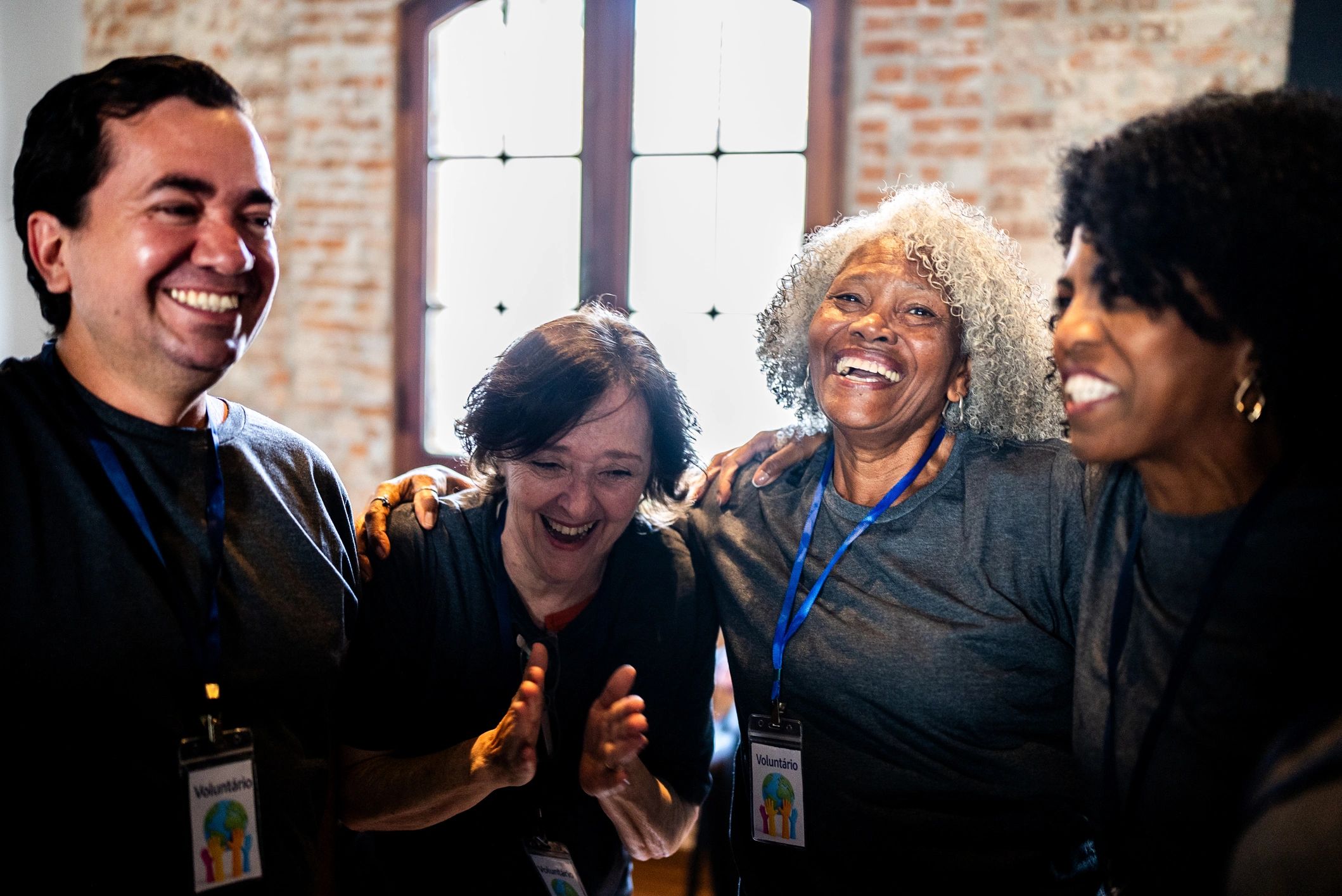 Project Evolution team members embracing during community outreach